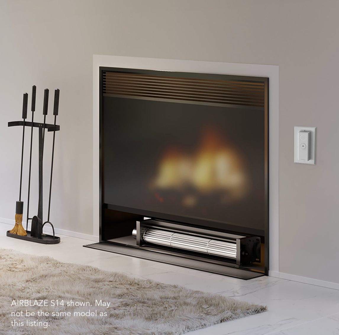 AC Infinity AIRBLAZE S10 installed beneath a fireplace, demonstrating efficient heat circulation setup