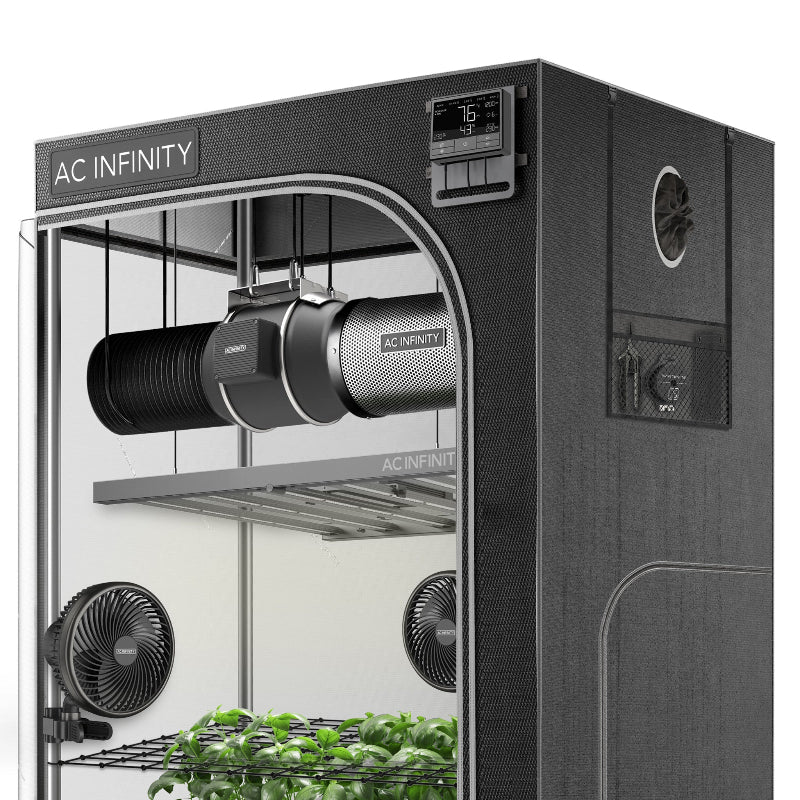 Professional indoor growing environment by AC Infinity with automated climate controls and complete ventilation system in action.