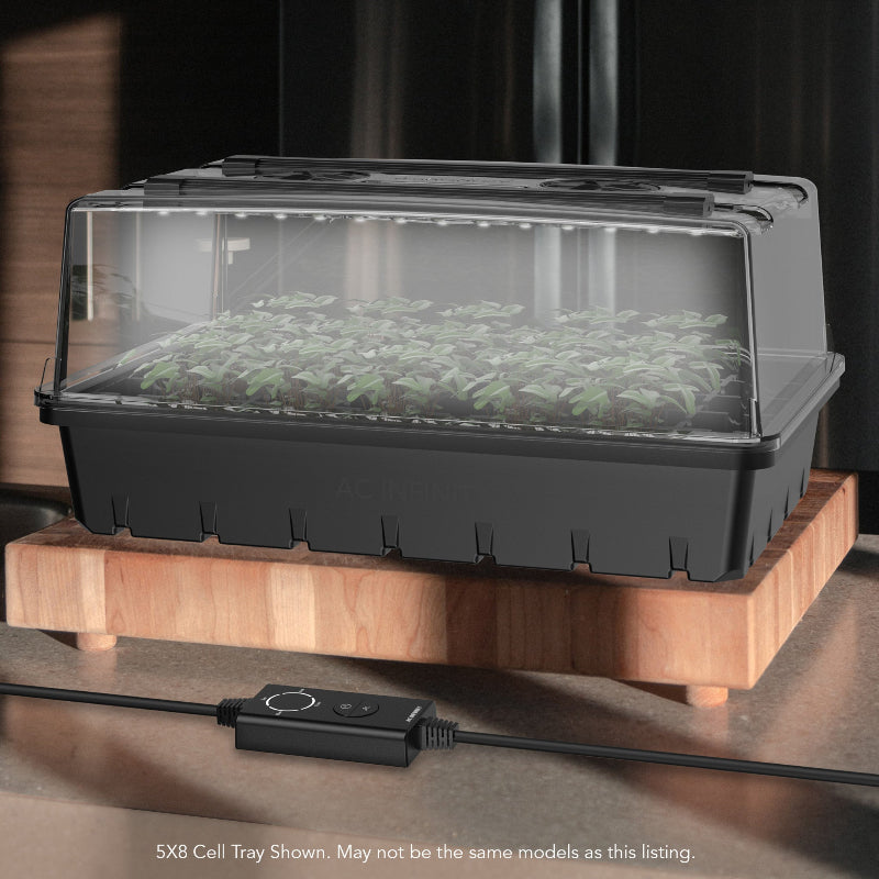 Indoor propagation kit with humidity dome and LED grow light system for seedling growth and plant propagation.