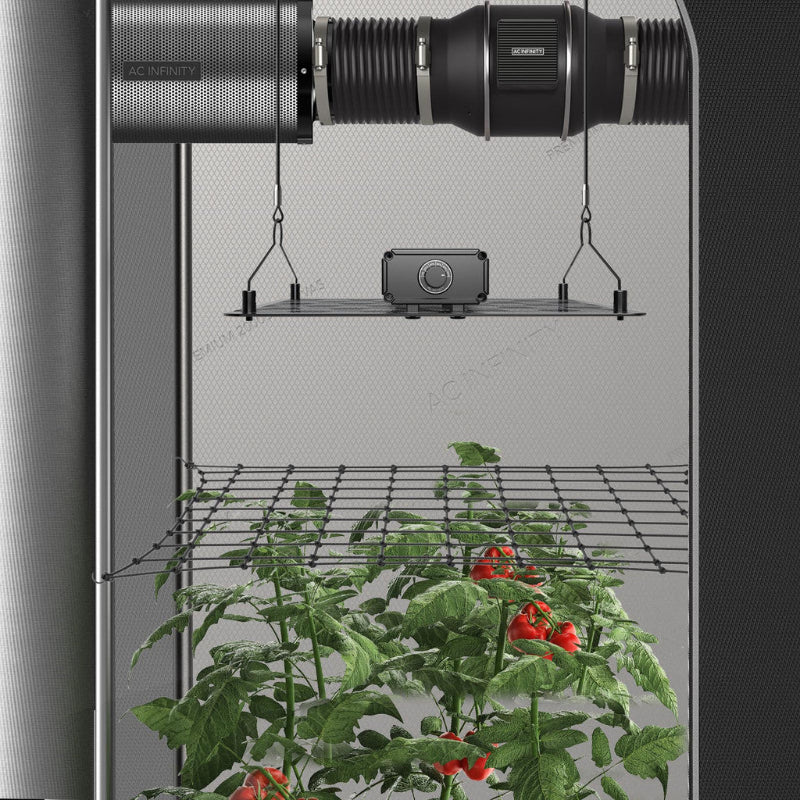 2x2 grow tent mounting bars supporting ventilation system and grow light, demonstrated in active indoor growing setup.