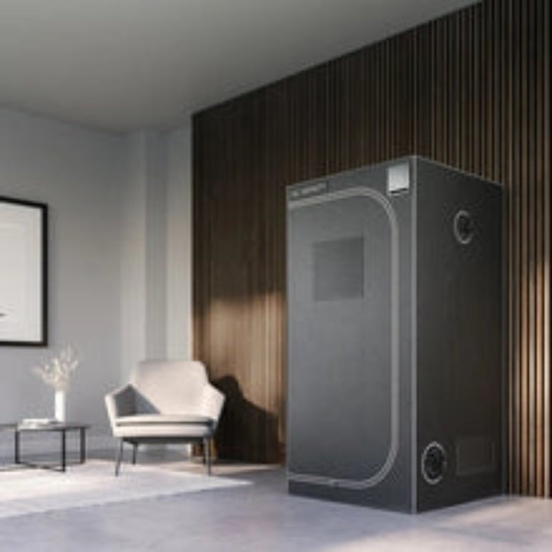 A minimalist, modern living room features a sleek AC Infinity grow tent, set against a dark wood accent wall.