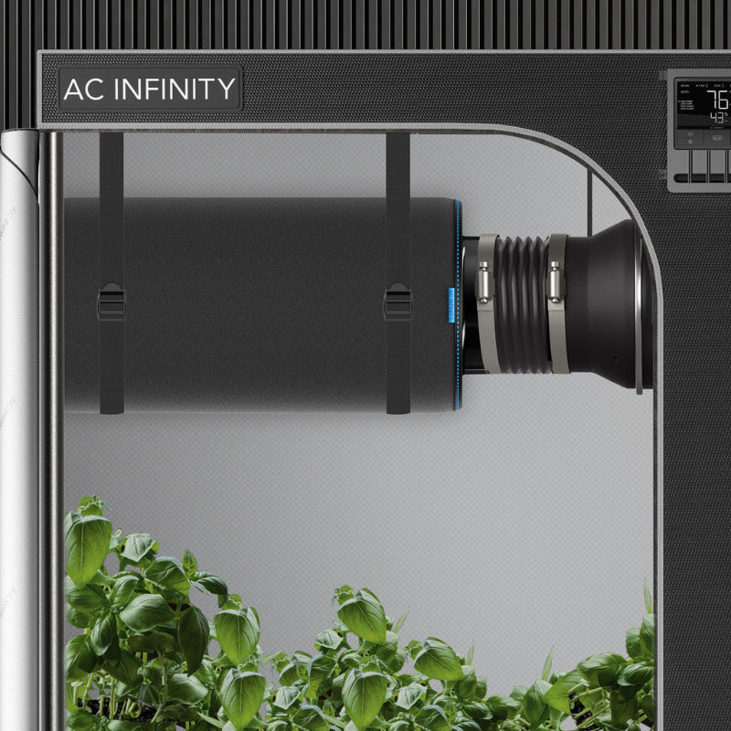 AC Infinity 4-inch duct carbon filter shown installed in professional grow tent setup with mounting straps and flexible ducting for efficient air filtration and ventilation.