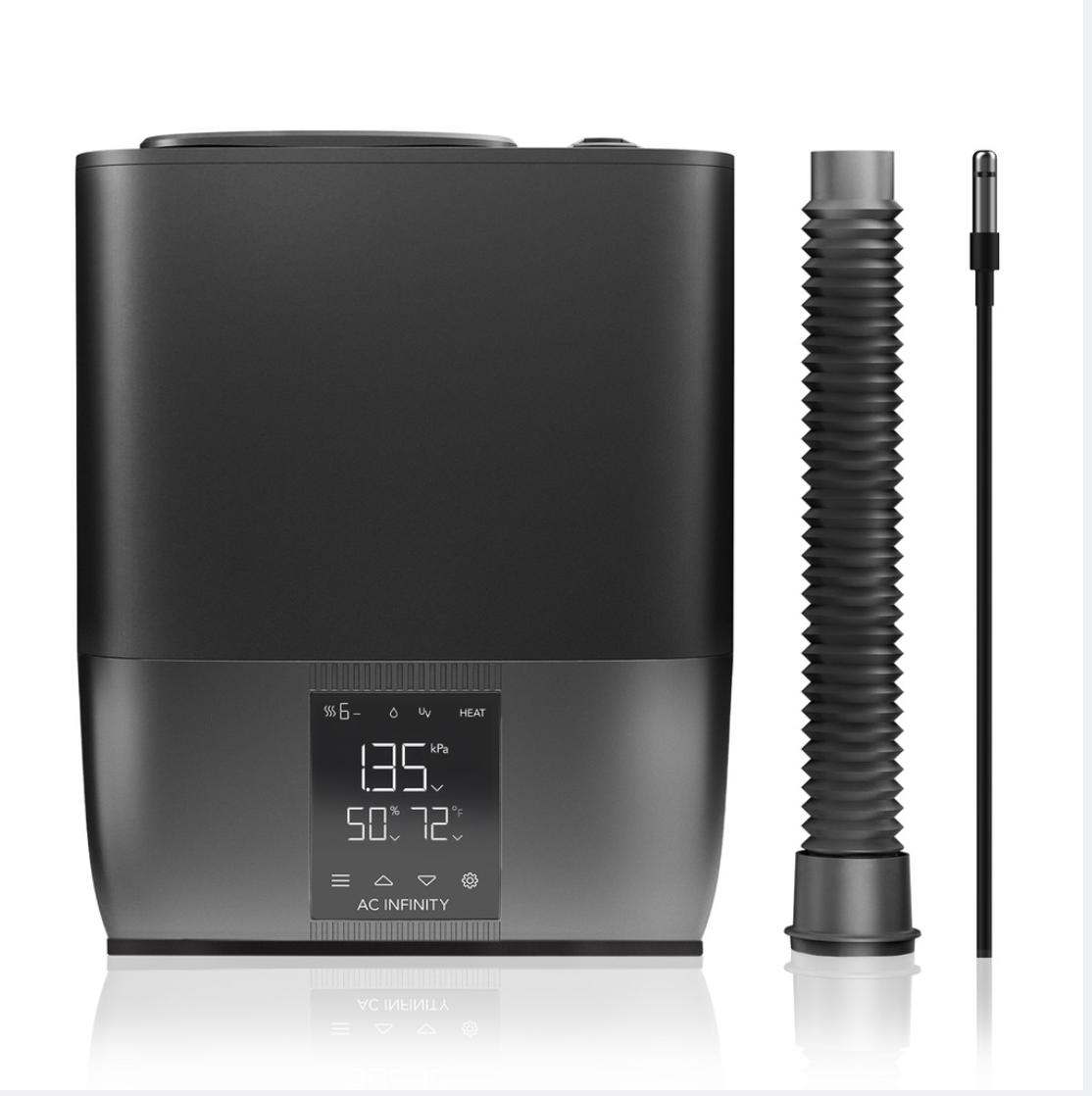 Black humidifier with digital display and flexible hose on a white background